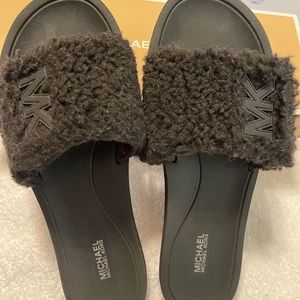 Michael Kors Slides. New in box. Size 9. Comes from smoke and pet free home.
